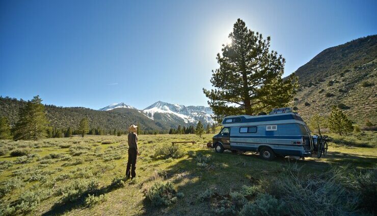 https://www.freepik.com/free-photo/beautiful-shot-female-standing-grassy-field-near-van-with-mountain_7822627.htm