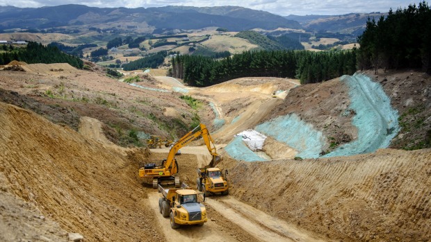 construction-of-a-transmission-gully-motorway-access-track-heading-north-from-state-highway-58-pauatahanui-and-judgeford-can-be-seen-in-the-background