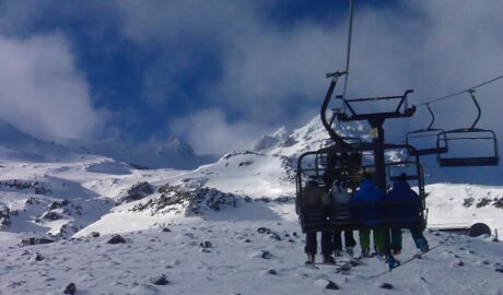 Skiers on a chairlift at Turoa ski field