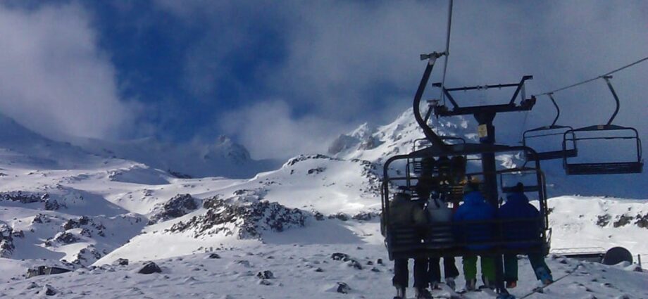 Skiers on a chairlift at Turoa ski field