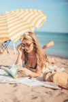 Photo by Şule Makaroğlu: https://www.pexels.com/photo/women-s-lying-on-the-beach-sand-reading-a-book-3087898/